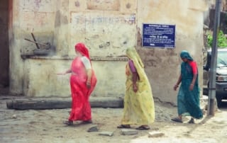 Three women walking by